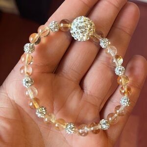 Citrine bead with bling bead 
For small wist